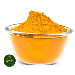 Kaadu own farm produce turmeric powder kept in a glass bowl